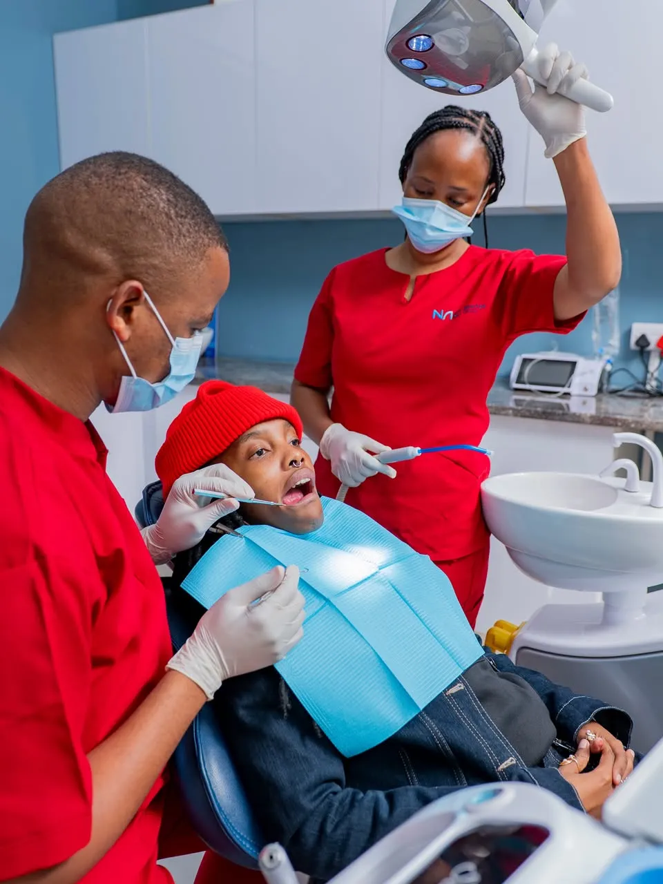 NewAge Clinic dentist and assistant treating a patient